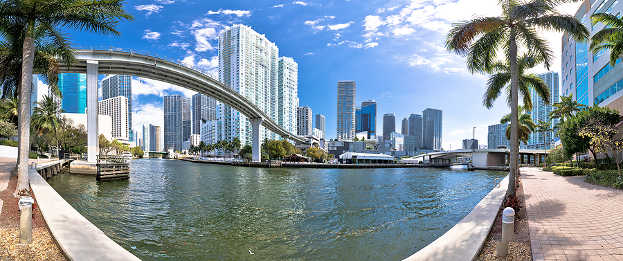 Miami Downtown Skyline And Futuristic Mover Train Above Miami Ri